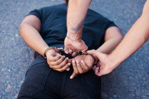 arrested man on the ground