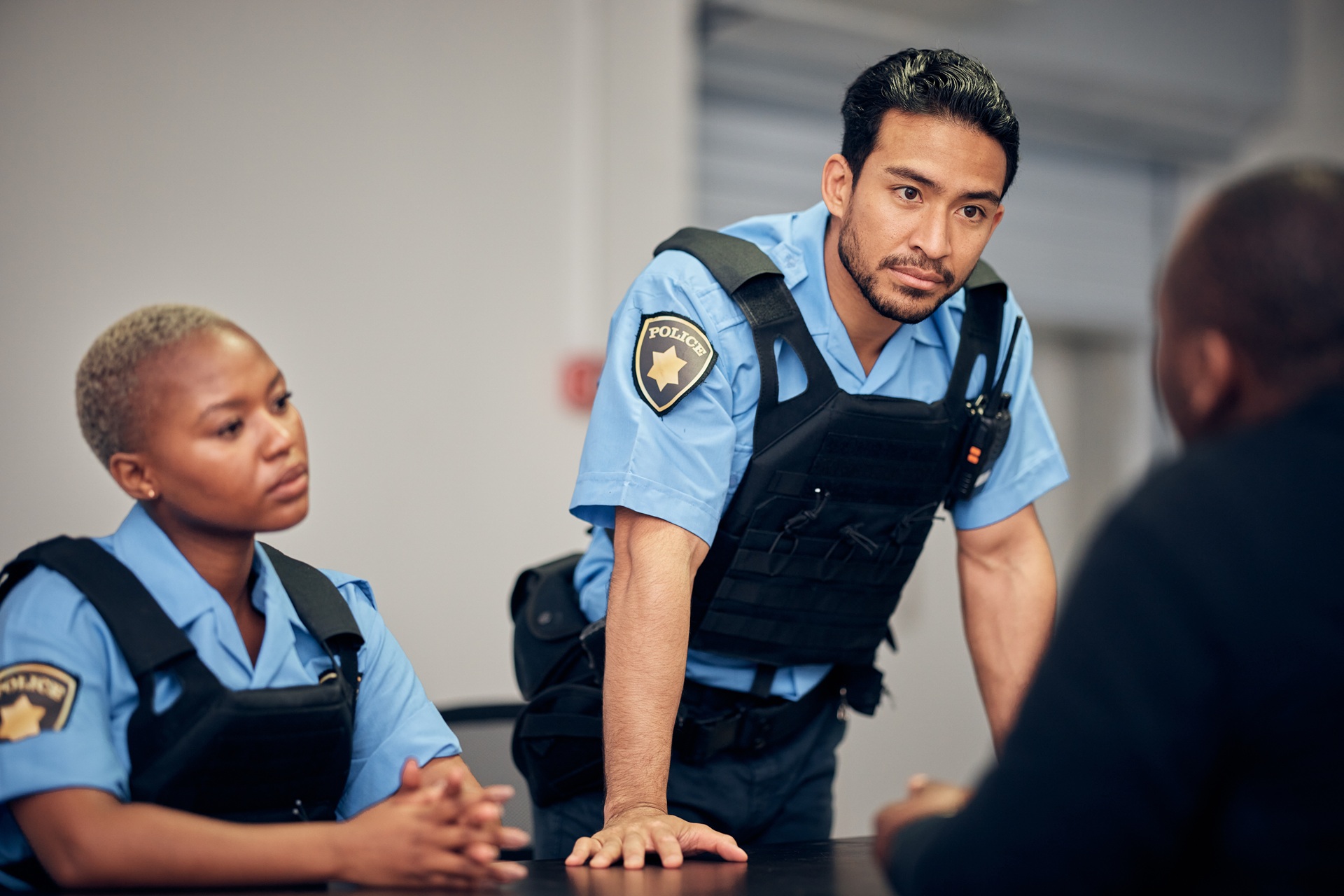 Police officers talking to a man