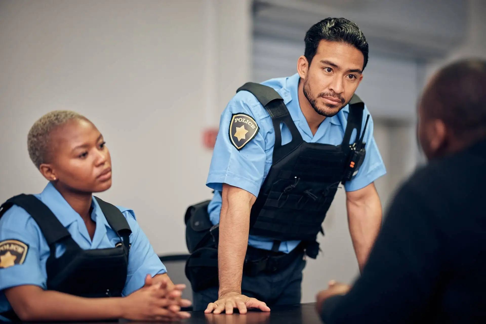Police officers talking to a man