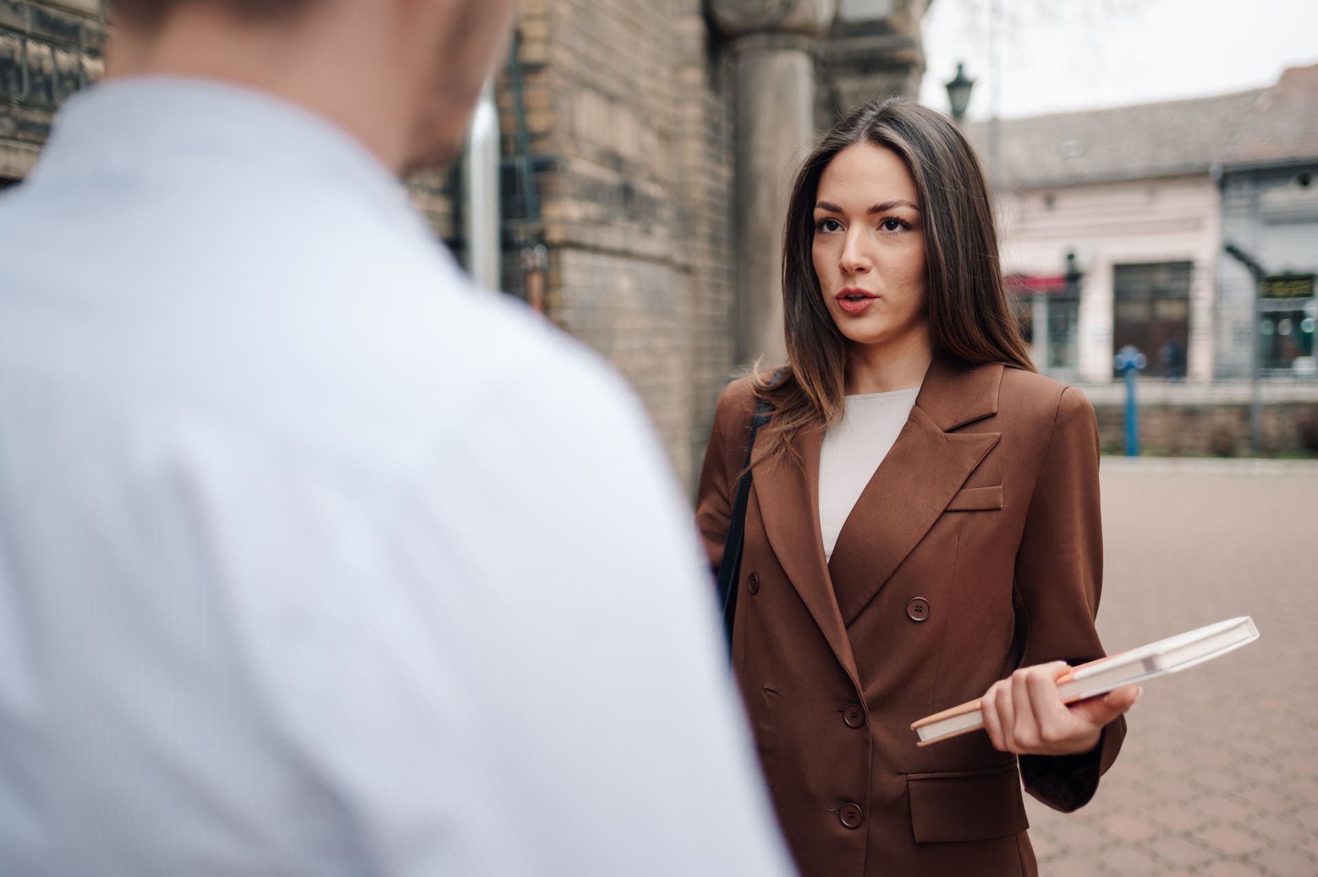 Lawyer talking to defendant outdoors