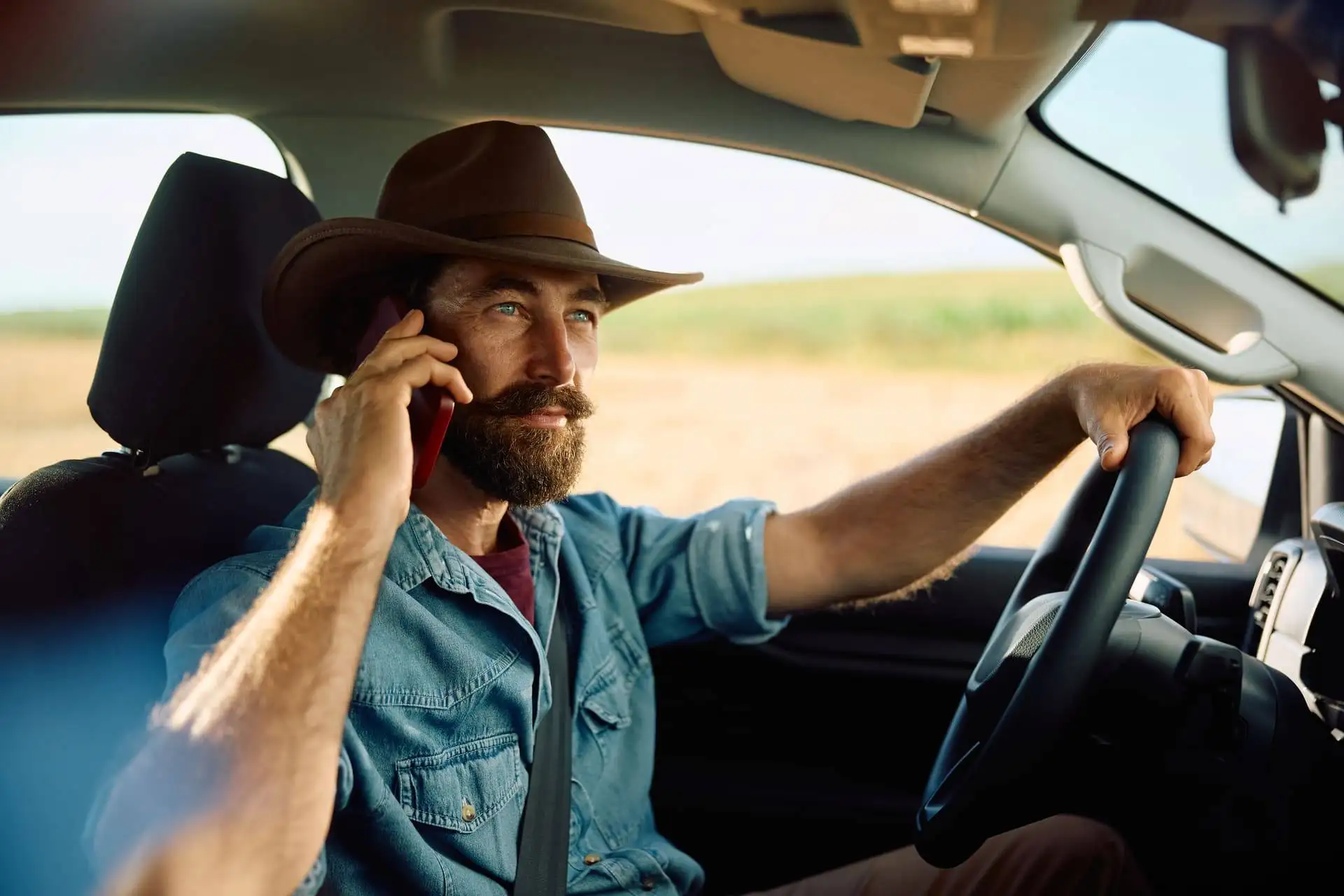 farmer talking on phone while driving