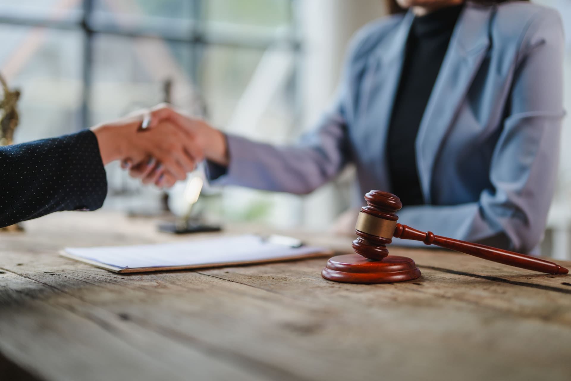 Lawyer shaking hand with defendant