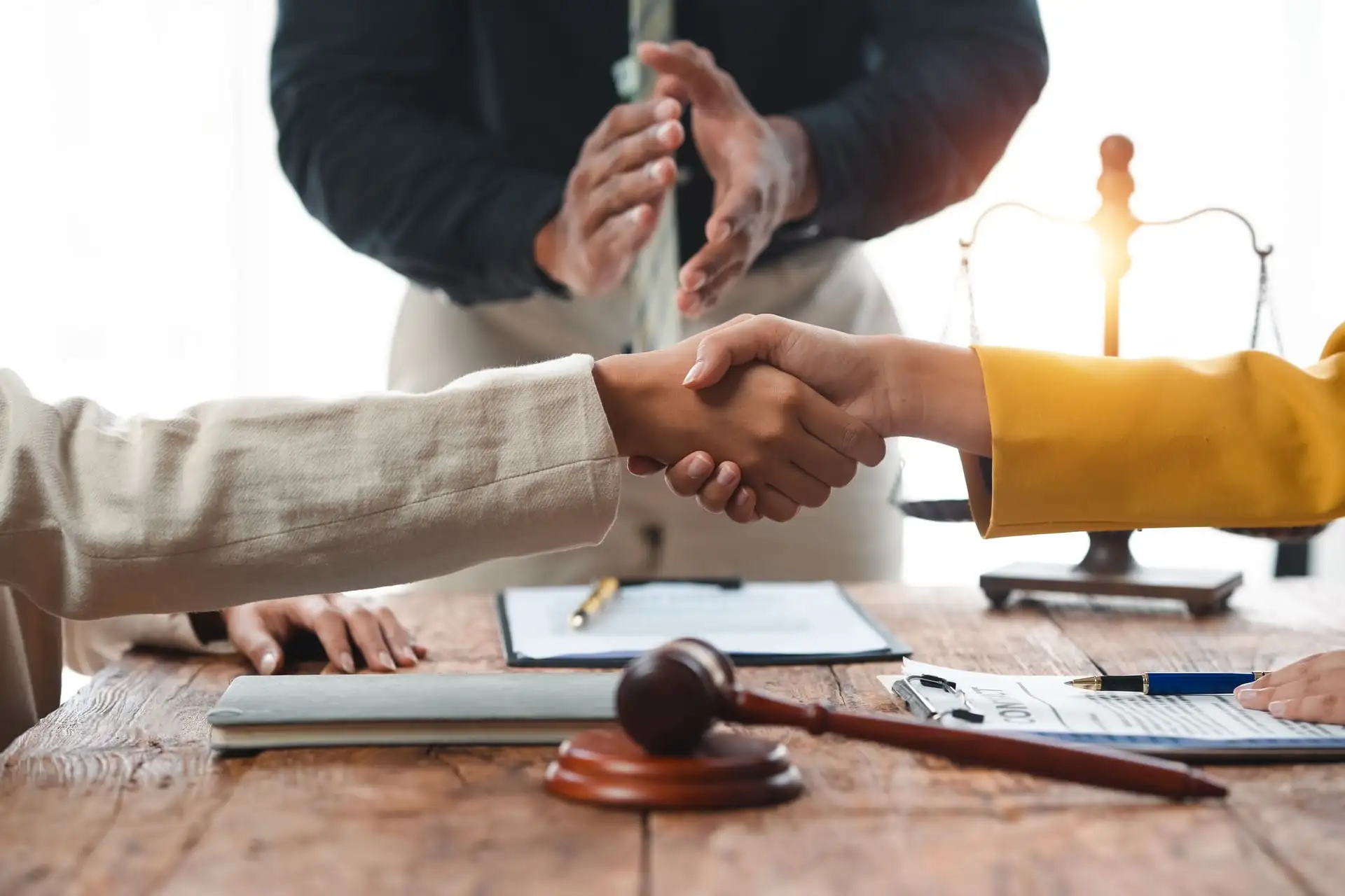 cleints shaking hands with lawyer
