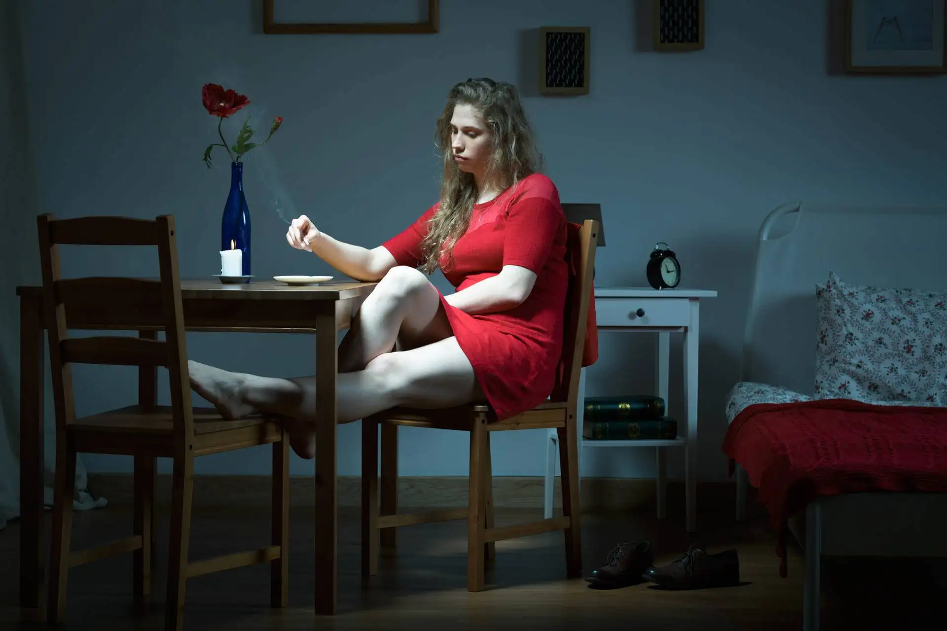 Female sitting next do table after disturbing, violent disupte